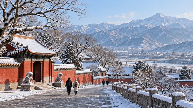 Snow-covered northern Chinese architecture and mountains in clear winter light